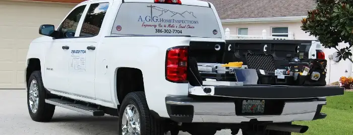 Parked AGG Home Inspections' truck and tools