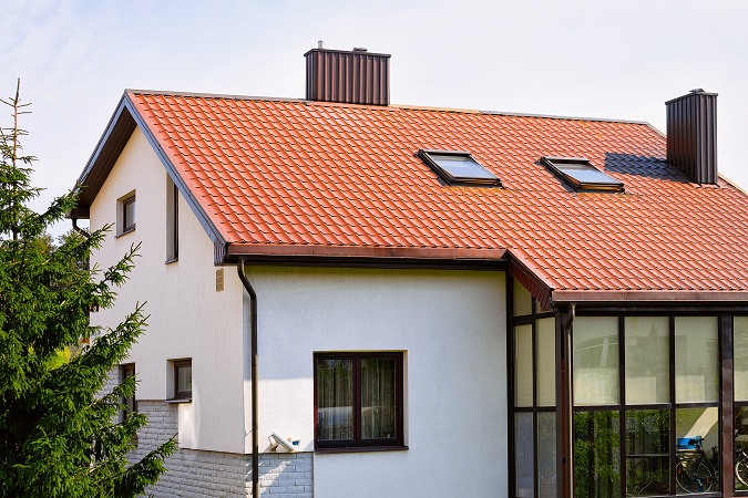 Beautiful white home with a red roof